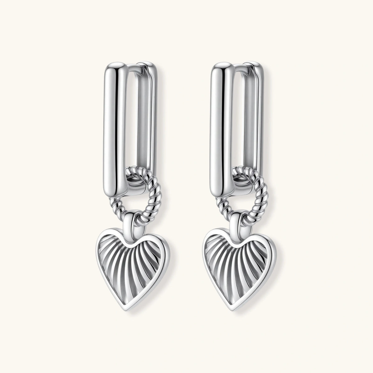 Platinum-plated 925 sterling silver rectangular hoop earrings with twisted ring connector and ribbed heart charm pendant.
